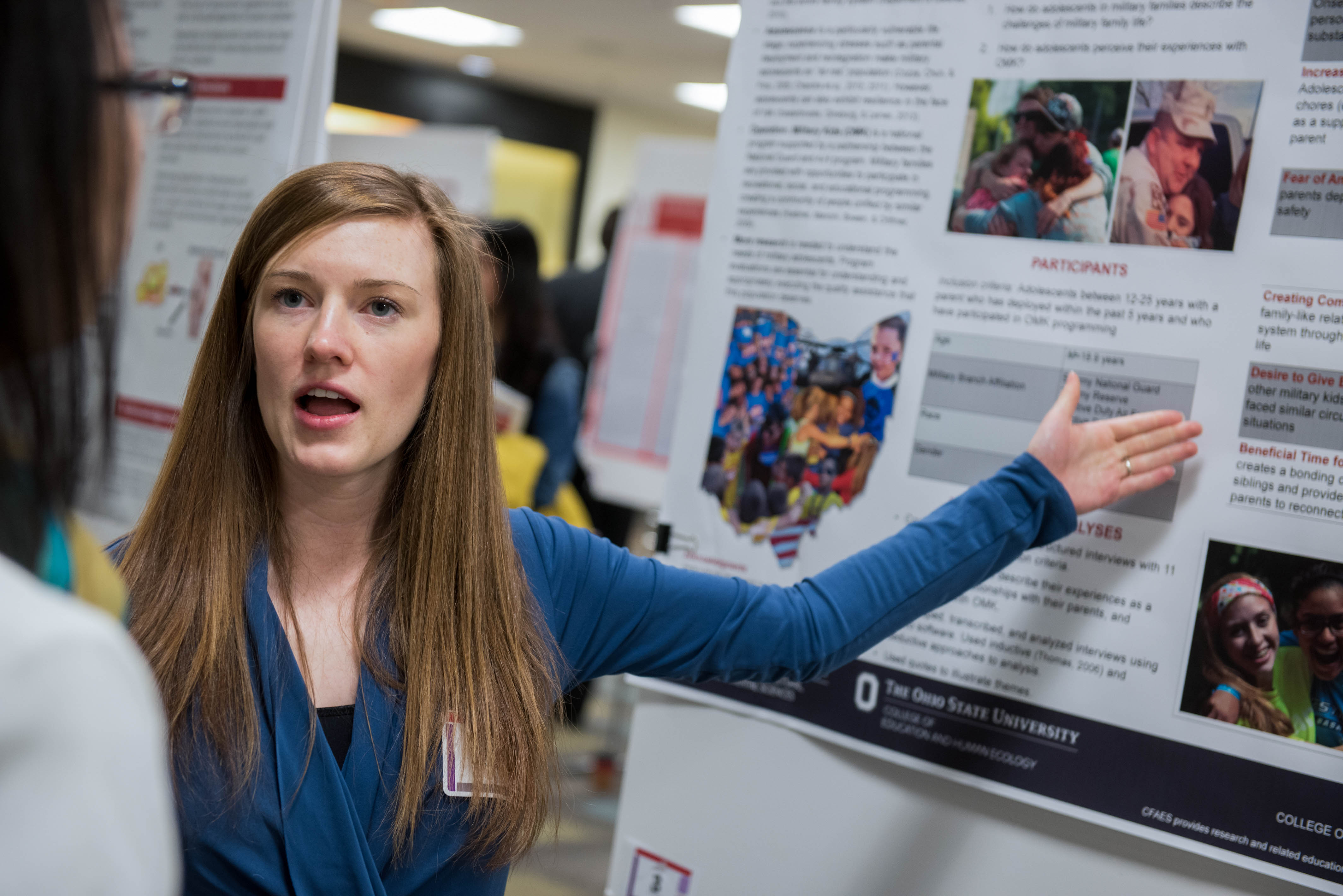 student with research poster