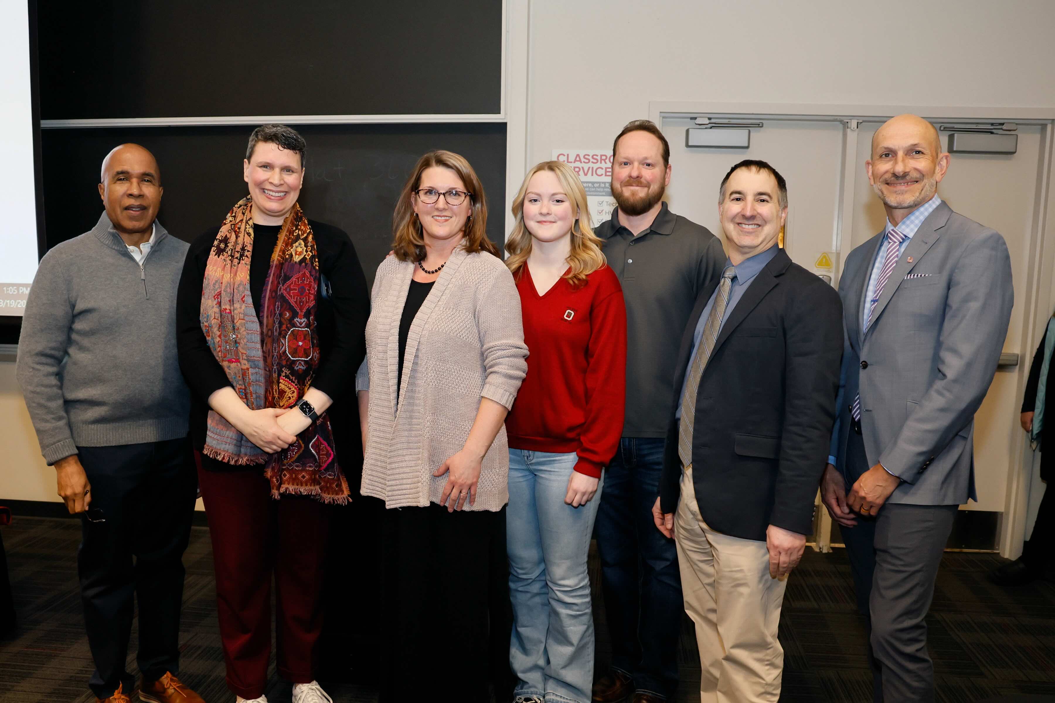 Angela Collene receiving an award with other Ohio State faculty members