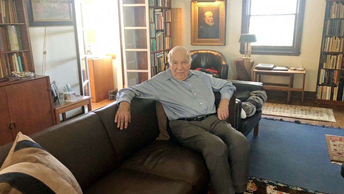 Daniel Tanner sitting on couch