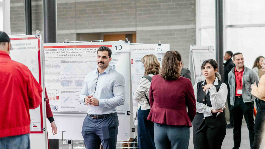Ohio State students with their research posters presenting at Research Symposium