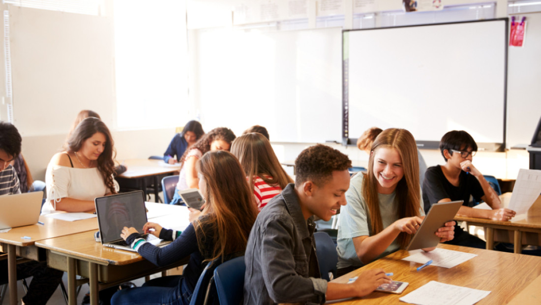 Highschool classroom with students working at their desks