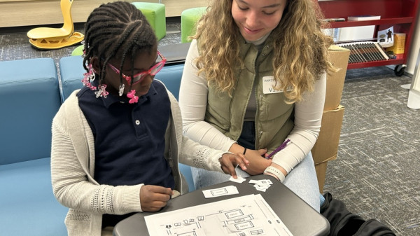 Ohio State student teacher reading with a young student