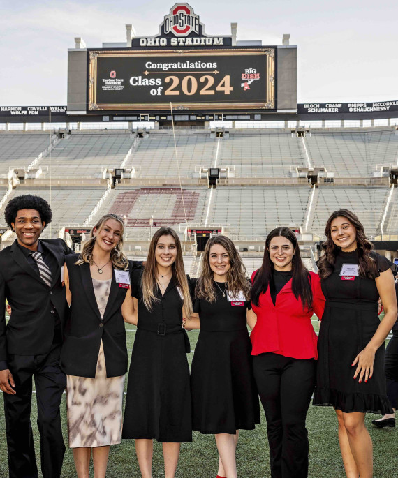 Ohio State students on the football field celebrating the Big Dish event