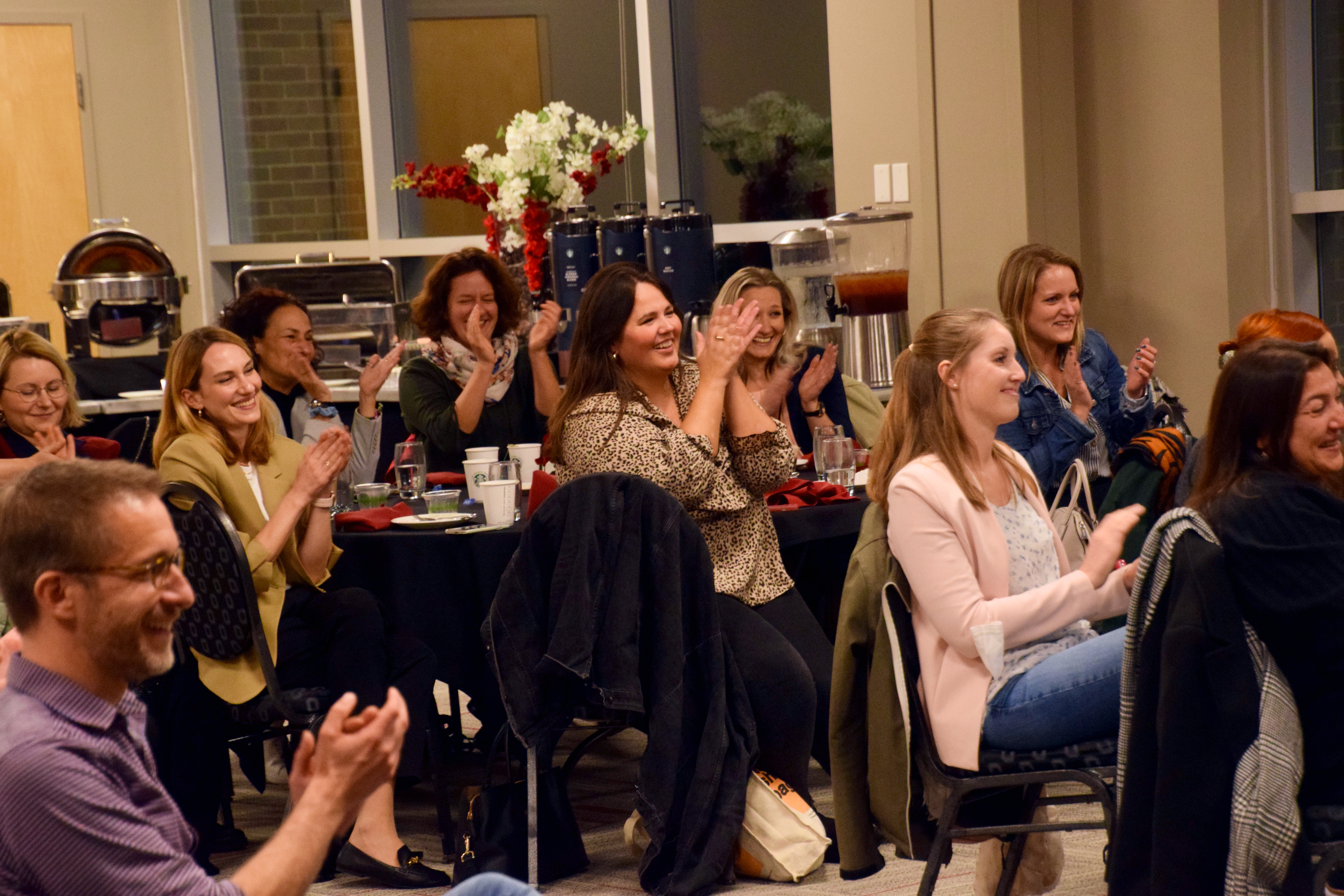 Audience members cheering at German American Fulbright closing ceremony celebration