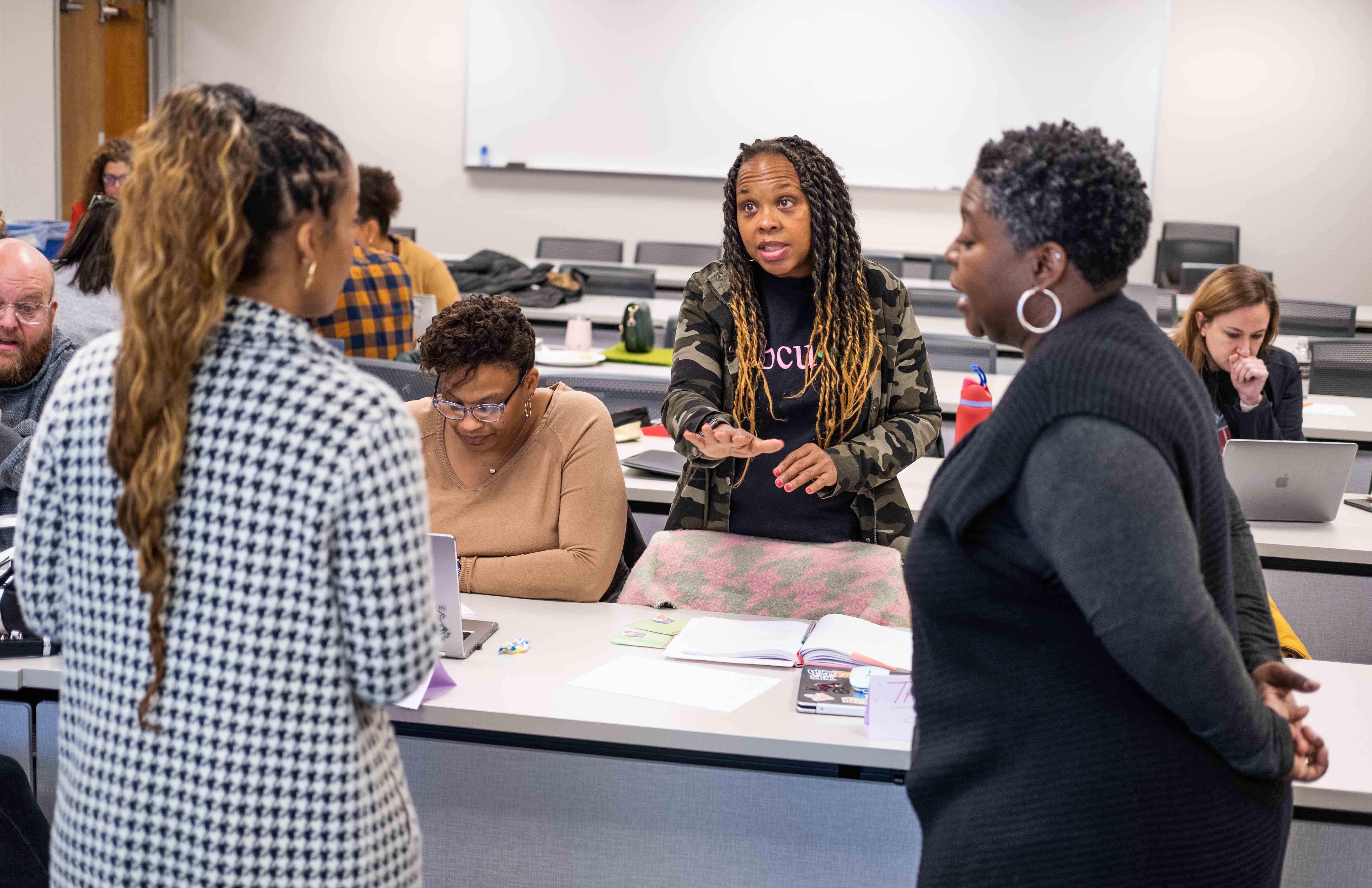 Tonya Spencer working with educators at a classroom table