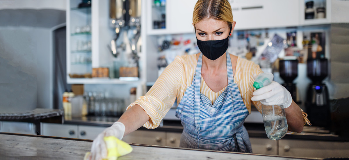 woman cleaning coffee shop